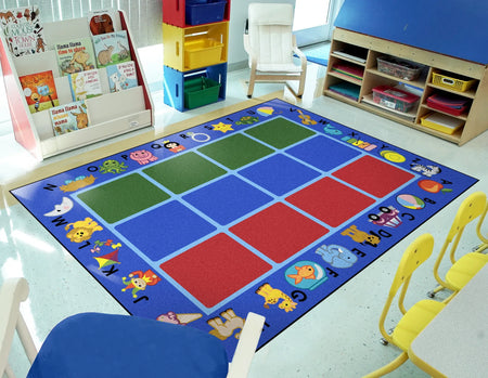 Alphabet Phonics 5'4" x 7'8" area rug in color Blue
