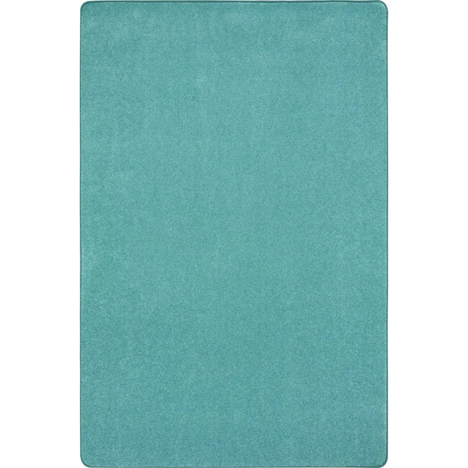 Just Kidding 6' x 9' area rug in color Seafoam