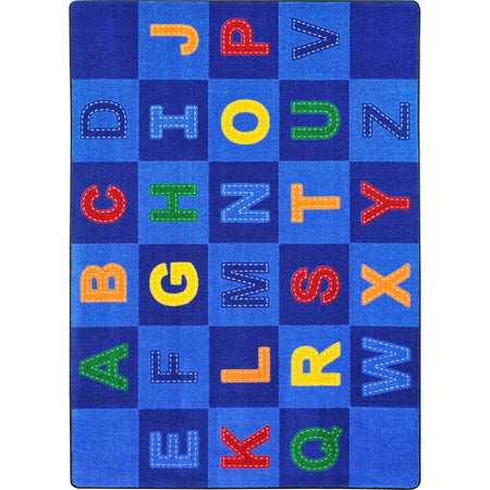 Patchwork Letters 10'9" x 13'2" area rug in color Multi